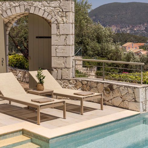 sunbeds beside the pool